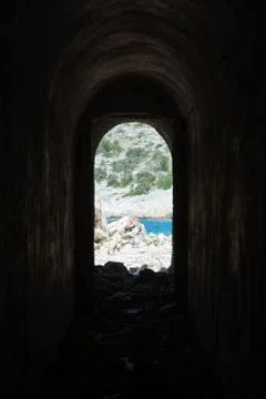 Looking out of corridor of an abandoned second world war bunker in Croatia Stock Photos