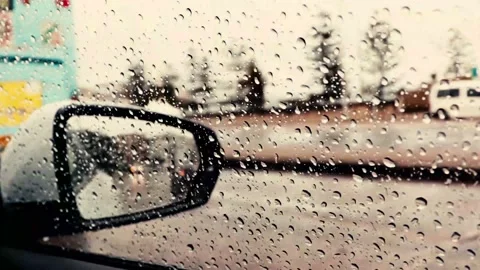 Looking out from the driver seat of a car to a blurred view of Campbell Parade i Stock Footage 146515462