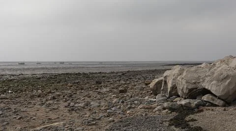 Looking out at an empty estuary from the beach Stock Photos