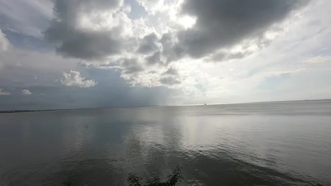 Looking out into the Gulf of Paria- cloud formations, islet Video stock 343318729