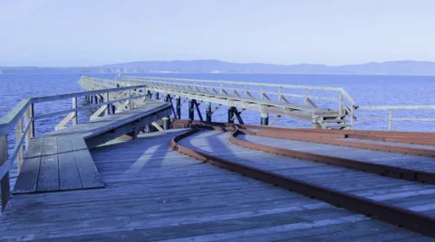 Looking out over a bay at an old lifeboat launching ramp, wide angle view Video stock 47328962