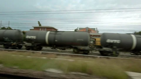 Looking out from Passing Train. Transport / Europe / Italy / Travel. Stock Footage 130927867
