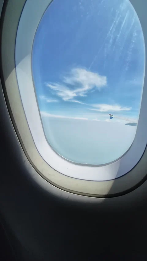 Looking Out Plane Window, Blue Sky and Bright Sun Stock Footage 276966069
