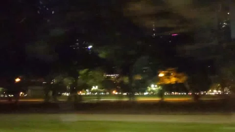 Looking out the side window of moving car driving in downtown Chicago at night Vídeos de archivo 231537393