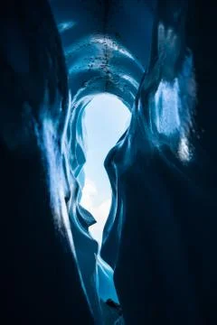 Looking out at the sky from deep inside a crevasse ice cave on the Matanuska  Stock Photos