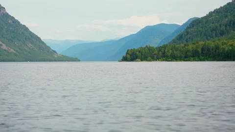 Looking out from the stern of a fast moving motor boat to it's large bright Stock Footage 277999635