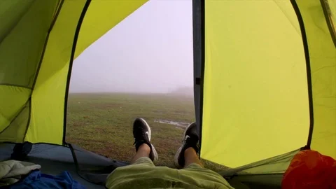 Looking out of a tent Stock Footage 119085375