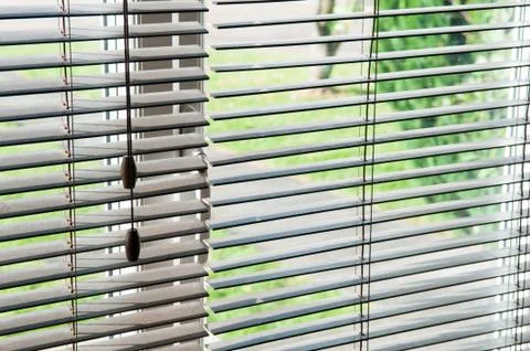 Looking out through an open blind and window Stock Photos