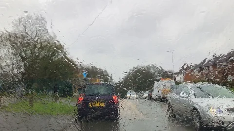 Looking out through a rain covered windscreen Stock Footage 125819698