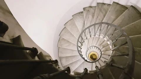 Looking out from the top of an ancient spiral staircase Stock Footage