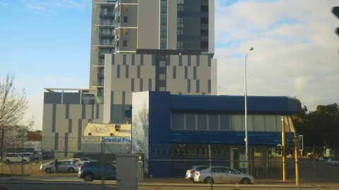 Looking out a train window leaving the city Stock Footage 92974000