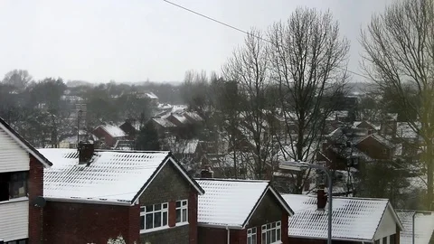 Looking out of the window across snowy rooftops Stock Footage 83408985