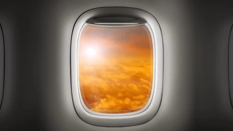 Looking out the window of an airplane as clouds pass by Stock Footage 86418970