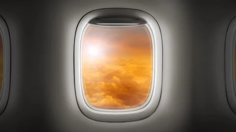 Looking out the window of an airplane as clouds pass by Stock Footage 86471156