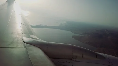 Looking out the window of an airplane though the clouds Stock Footage 109232475