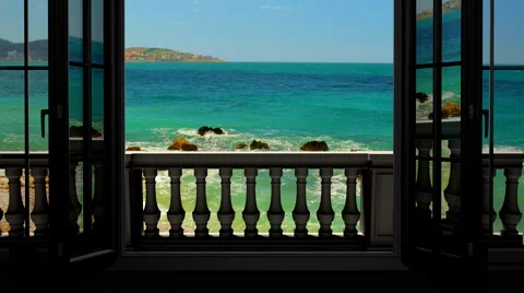 Looking out the window to the balcony and the sea Stock Footage 68623621