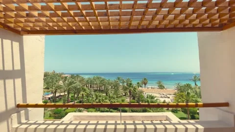 Looking out the window to the balcony and the sea Stock Footage 158130271