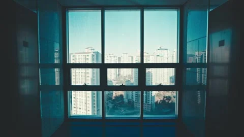 Looking out from the window in the building Video stock 262708592