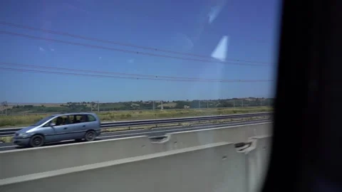 Looking out window as car is driving Vídeo Stock 197630754