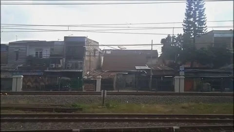 Looking out of the window of the commuterline train 動画素材 239713532