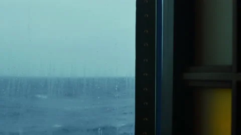 Looking out the window of a cruise ship Stockbeeldmateriaal 142050632