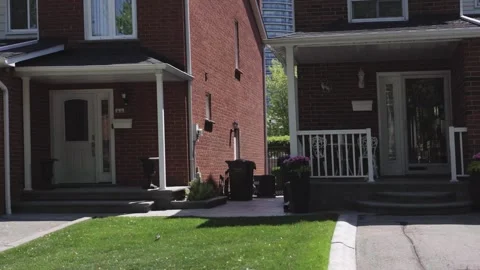 Looking out window driving by Canadian middle class suburb neighborhood  Stock Footage 244358327