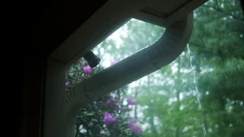 Looking out Window at Leaky Gutter System - Filler Shot - Drainage Flooding  Stock Footage 334900462