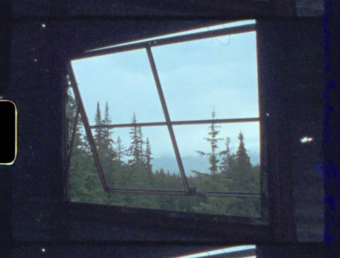 Looking Out Window In Mountains Moody Vintage 8mm Film Stock Footage 133659408