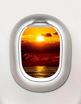 Looking out the window of a plane to the Black sea and sunset Stock Photos