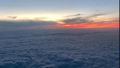 Looking Out the Window of a Plane, Cloudscape, View from the airplane with the s Stock Footage 302392411