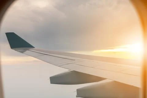 Looking out the window of a plane, a wing view of an aeroplane flying Photos