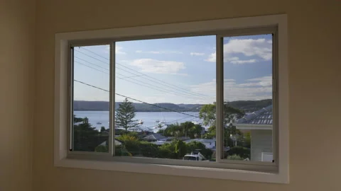 Looking out the window to scenic water view and truck passing by Stock Footage 149719341