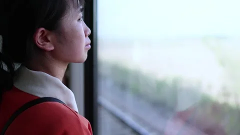 Looking out the window on the train home Stock Footage 242497653
