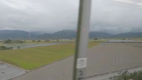 Looking out window train journey Taiwan Stock Footage 235170209