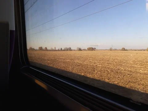 Looking out the window of a train. Stock Photos