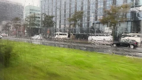 Looking outside from a fast moving bus window, commute in rainy day,travel Stockbeeldmateriaal 255227189