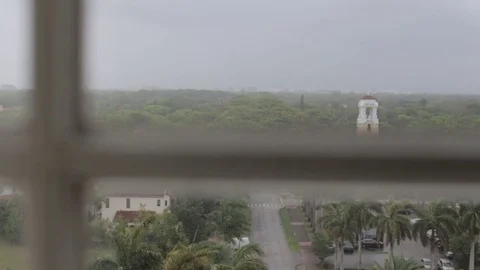 Looking Outside a Hotel Window while Raining Outside Stock Footage 76356532