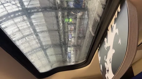 Looking outside from train window with rain falling, sad, solo travel concept Video stock 255227268