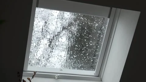 Looking outside a window to the backyard while a heavy storm brings hail Stock Footage 305601630