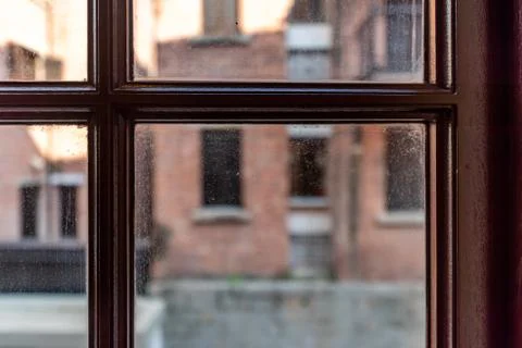 Looking outside the window grille Foto stock