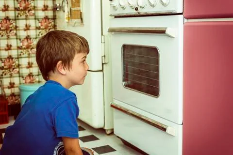 Looking at oven in an old kitchen Stock Photos