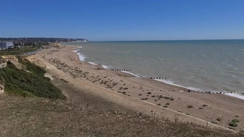 Looking over a beach from a hilltop 動画素材 144322383
