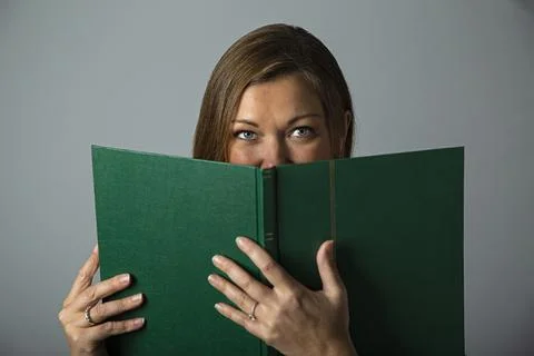 Looking over book Foto stock