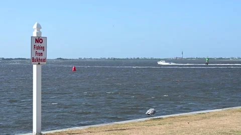 Looking over the bulkhead at the Cape fear river in Southport NC Stock Footage 136380217