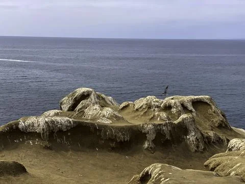 Looking over cliffs into the ocean Stock Photos