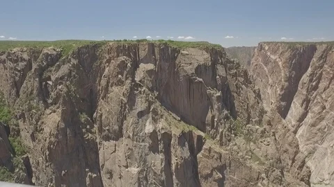Looking Over the Edge of Black Canyon of the Gunnision National Park Stock Footage 121639798