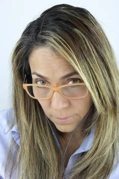 Looking over glasses Stock Photos