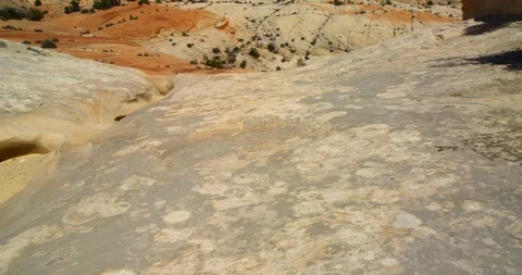 Looking over gullies cut into desert sandstone from eons of rain, Utah Stock Footage 124503049