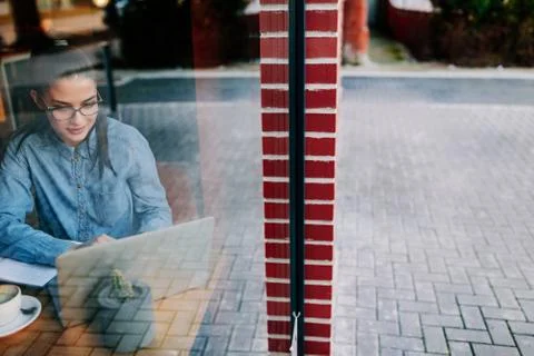 Looking over her study material Stock Photos