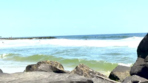 Looking over Large Rocks at Asbury Parks Surf Beach Stock-Footage 341402891
